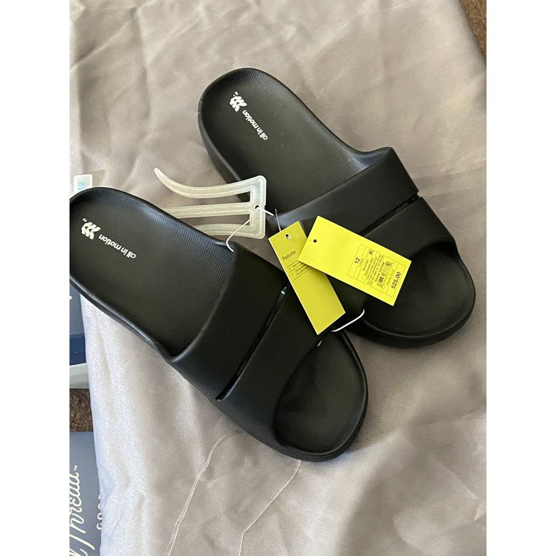 men Black slide sandal on a light gray background