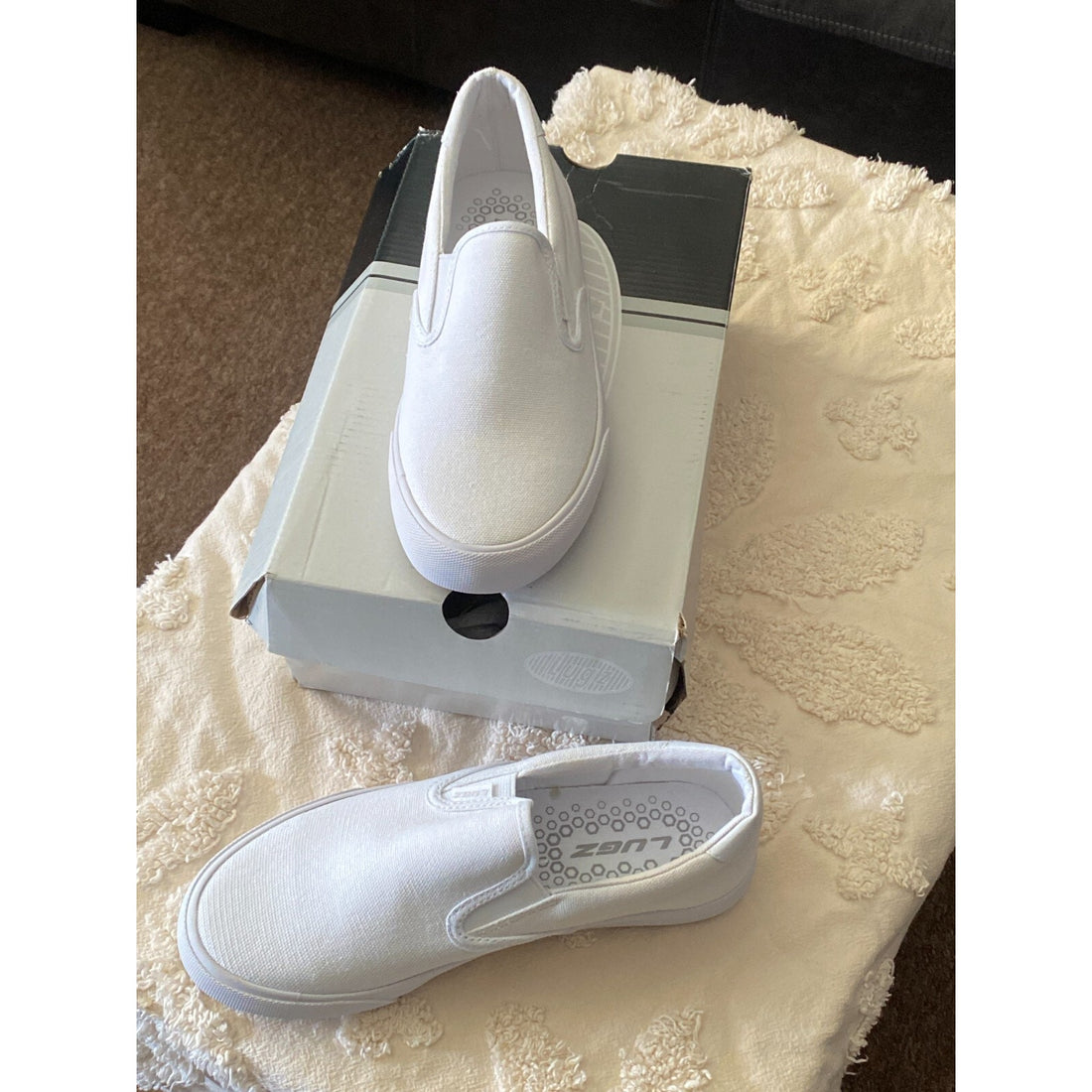 White slip-on sneaker on a white background