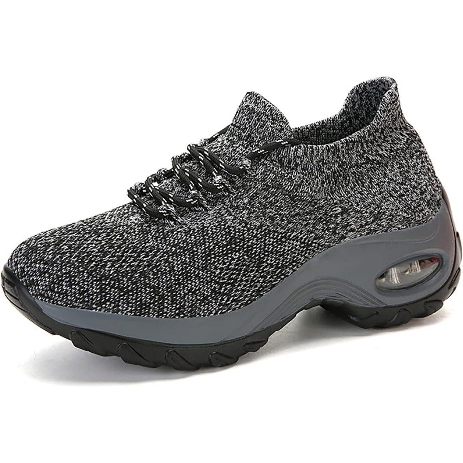 Gray athletic shoe with textured upper and black sole on a white background